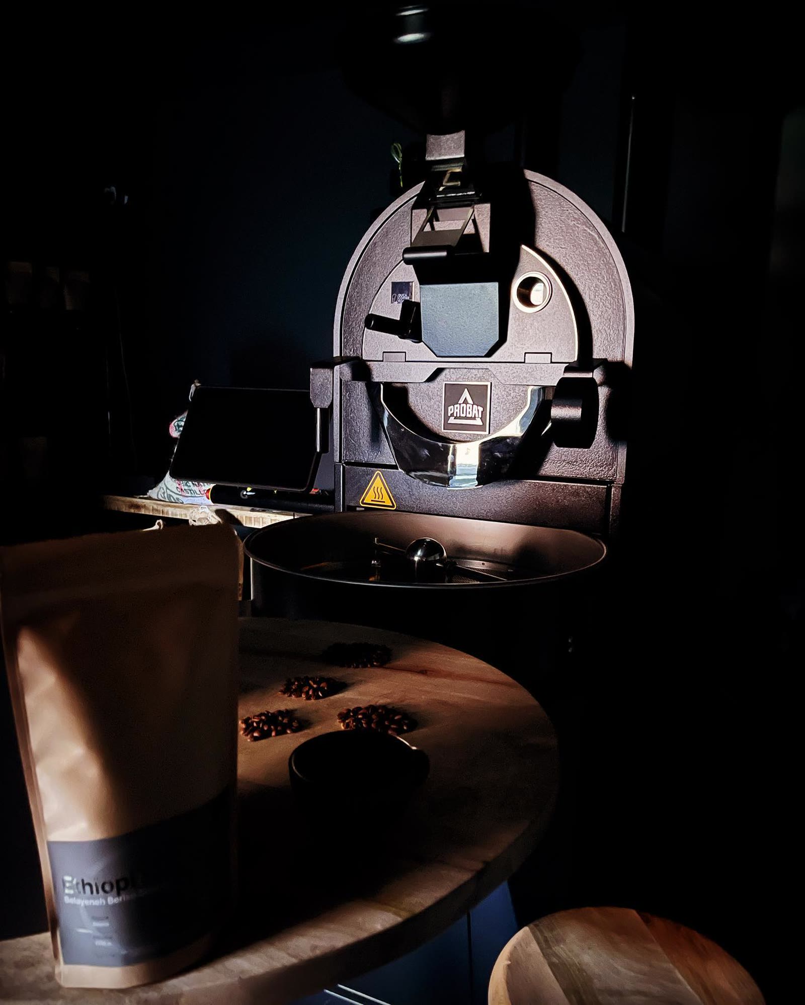 A bag of single-origin Ethiopia beans in front of the roaster